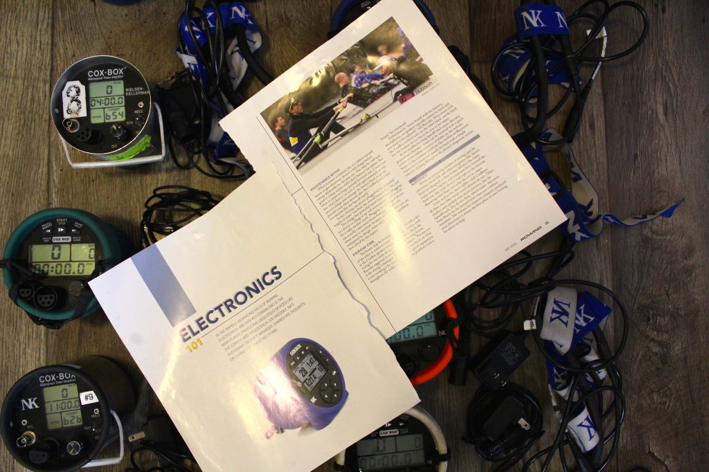 An article called "Electronics 101" placed on top of cox boxes and their headsets.